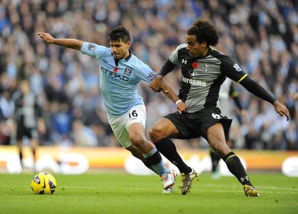 Sergio Kun Aguero of Manchester City tussles with Tom Huddlestone of Tottenham - Barclays Premier League - Manchester City vs Tottenham Hotspur - Etihad Stadium - Manchester - 11 11 12 - EDITORIAL USE ONLY. No use with unauthorised audio, video, data, fixture lists, club league logos or live services. Online in-match use limited to 120 images, no video emulation. No use in betting, games or single club league player publications.