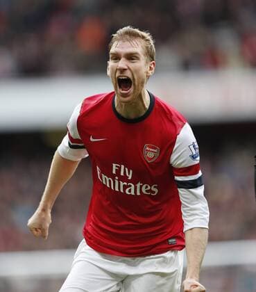 Arsenal s Per Mertesacker celebrates scoring his side opening goal..Arsenal FC London v Tottenham Hotspur - Premier League- Emirates Stadium, London- 17 11 12 - EDITORIAL USE ONLY. No use with unauthorised audio, video, data, fixture lists, club league logos or live services. Online in-match use limited to 120 images, no video emulation. No use in betting, games or single club league player publications.