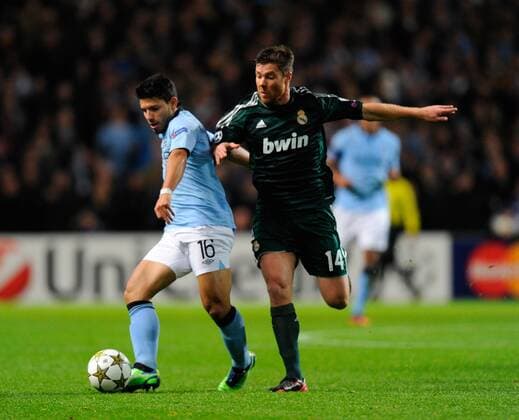 Sergio Kun Agüero of Manchester City tussles with Xabi Alonso of Real Madrid - UEFA Champions League Group D - Manchester City vs Real Madrid - Etihad Stadium - Manchester - 21 11 12 - Picture SimonxBellis Sportimage- EDITORIAL USE ONLY. No use with unauthorised audio, video, data, fixture lists, club league logos or live services. Online in-match use limited to 120 images, no video emulation. No use in betting, games or single club league player publications.