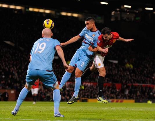 Robin van Persie of Manchester United heads the ball towards goal - Barclays Premier League - Manchester Utd vs West Ham Utd - Old Trafford Stadium - Manchester - 28 11 12 EDITORIAL USE ONLY. No use with unauthorised audio, video, data, fixture lists, club league logos or live services. Online in-match use limited to 120 images, no video emulation. No use in betting, games or single club league player publications.