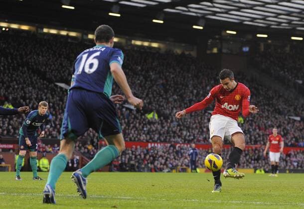 Robin van Persie of Manchester United scores the first - On the left: John Oshea - Barclays Premier League - Manchester United vs AFC Sunderland - Old Trafford Stadium - Manchester - 15 12 12 EDITORIAL USE ONLY. No use with unauthorised audio, video, data, fixture lists, club league logos or live services. Online in-match use limited to 120 images, no video emulation. No use in betting, games or single club league player publications.