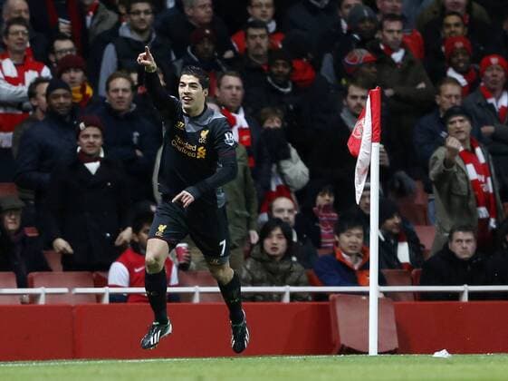 Liverpool s Luis Suarez celebrates scoring his sides opening goal.. - FC Arsenal vs FC Liverpool - Barclays Premier League - Emirates Stadium, London- 30 01 13 - EDITORIAL USE ONLY. No use with unauthorised audio, video, data, fixture lists, club league logos or live services. Online in-match use limited to 120 images, no video emulation. No use in betting, games or single club league player publications.