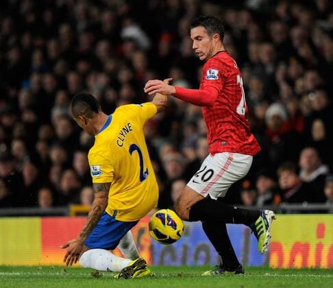 Robin van Persie of Manchester United tussles with Nathaniel Clyne of Southampton - Barclays Premier League - Manchester United (ManU) vs FC Southampton - Old Trafford Stadium - Manchester - 30 01 13 - Picture Simon Bellis Sportimage EDITORIAL USE ONLY. No use with unauthorised audio, video, data, fixture lists, club league logos or live services. Online in-match use limited to 120 images, no video emulation. No use in betting, games or single club league player publications.