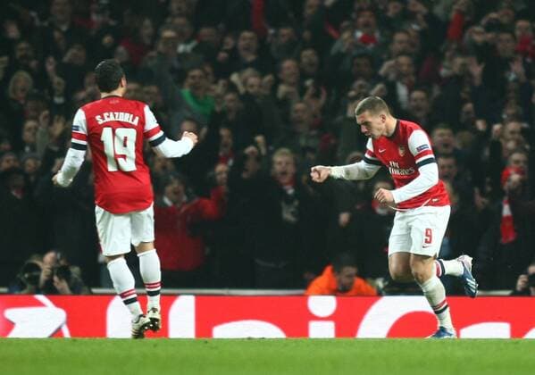 Arsenal s Lukas Podolski celebrates scoring his sides first goal Football - UEFA Champions League - round of 16 - First Leg - Arsenal London v Bayern Munich - 19th February 2013 - Emirates Stadium - London - UK 19022013ArsenalvsBayernMZE08