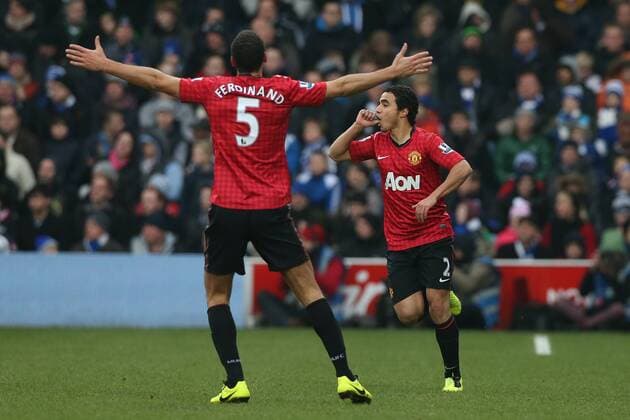 Football - 2012 2013 Premier League - Queens Park Rangers vs. Manchester United (ManU) Manchester United (ManU) s Rafael celebrates scoring by sucking his thumb with Manchester United (ManU) s Rio Ferdinand at Loftus Road, London