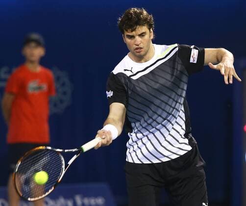 Dubai Tennis Championships 2013, ATP Tennis Herren Tennis Turnier,International Series,Dubai Tennis Stadium, U.A.E.,Malek Jaziri (TUN),Aktion,Einzelbild, Halbkoerper,Querformat,