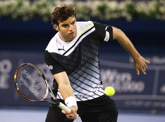 Dubai Tennis Championships 2013, ATP Tennis Herren Tennis Turnier,International Series,Dubai Tennis Stadium, U.A.E.,Malek Jaziri (TUN),Aktion,Einzelbild, Halbkoerper,Querformat,