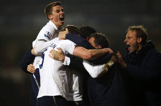 LONDON, Gareth Bale (C) of Tottenham Hotspur celebrates scoring the winning goal with Andre Villas-Boas, manager of Tottenham Hotspur, and team members during the Barclays Premier League match between West Ham United and Tottenham Hotspur at the Boleyn Ground, Upton Park, in London, Britain on February 25, 2013. Tottenham Hotspur won 3-2 and lift into third in the table. (Xinhua Wang Lili) FOR EDITORIAL USE ONLY. NOT FOR SALE FOR MARKETING OR ADVERTISING CAMPAIGNS. NO USE WITH UNAUTHORIZED AUDIO, VIDEO, DATA, FIXTURE LISTS, CLUB LEAGUE LOGOS OR LIVE SERVICES. ONLINE IN-MATCH USE LIMITED TO 45 IMAGES, NO VIDEO EMULATION. NO USE IN BETTING, GAMES OR SINGLE CLUB LEAGUE PLAYER PUBLICATIONS. BRITAIN-LONDON-SOCCER-PREMIER LEAGUE-TOTTENHAM HOTSPUR VS WEST HAM UTD