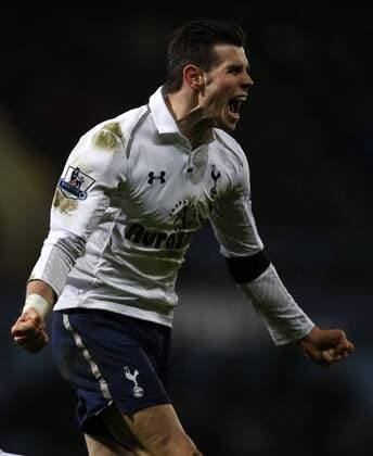 LONDON, Gareth Bale of Tottenham Hotspur celebrates scoring the winning goal during the Barclays Premier League match between West Ham United and Tottenham Hotspur at the Boleyn Ground, Upton Park, in London, Britain on February 25, 2013. Tottenham Hotspur won 3-2 and lift into third in the table. (Xinhua Wang Lili) FOR EDITORIAL USE ONLY. NOT FOR SALE FOR MARKETING OR ADVERTISING CAMPAIGNS. NO USE WITH UNAUTHORIZED AUDIO, VIDEO, DATA, FIXTURE LISTS, CLUB LEAGUE LOGOS OR LIVE SERVICES. ONLINE IN-MATCH USE LIMITED TO 45 IMAGES, NO VIDEO EMULATION. NO USE IN BETTING, GAMES OR SINGLE CLUB LEAGUE PLAYER PUBLICATIONS. BRITAIN-LONDON-SOCCER-PREMIER LEAGUE-TOTTENHAM HOTSPUR VS WEST HAM UTD