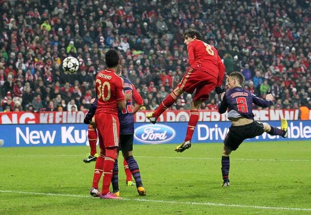 Arsenal s Laurent Koscielny scoring his sides second goal..Bayern Munich v Arsenal- UEFA Champions League - Second Round, Second Leg - Allianz Arena, Munich- 13 03 13 - Picture David Klein Sportimage EDITORIAL USE ONLY. No use with unauthorised audio, video, data, fixture lists, club league logos or live services. Online in-match use limited to 120 images, no video emulation. No use in betting, games or single club league player publications.