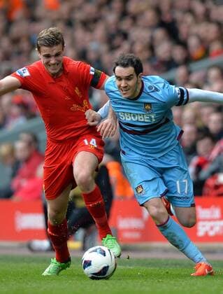 Jordan Henderson of Liverpool tussles with Joey O Brien of West Ham United - Barclays Premier League - Liverpool FC vs West Ham United - Anfield Stadium - Liverpool - England - 07 04 13 - EDITORIAL USE ONLY. No use with unauthorised audio, video, data, fixture lists, club league logos or live services. Online in-match use limited to 120 images, no video emulation. No use in betting, games or single club league player publications.