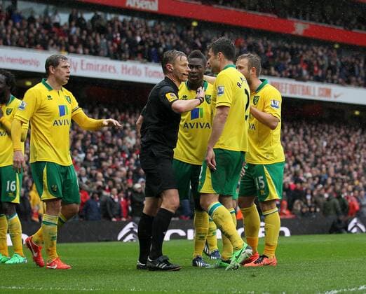 Norwich s players argue with referee Mike Jones after the award of a penalty.. FC Arsenal London vs Norwich City - Barclays Premier League - Emirates Stadium, London- 12 04 13 - EDITORIAL USE ONLY. No use with unauthorised audio, video, data, fixture lists, club league logos or live services. Online in-match use limited to 120 images, no video emulation. No use in betting, games or single club league player publications.
