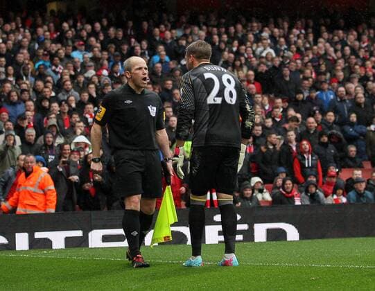 Norwich s Mark Bunn protests after the award of a penalty woth assistant referee Richard West.. FC Arsenal London vs Norwich City - Barclays Premier League - Emirates Stadium, London- 12 04 13 - EDITORIAL USE ONLY. No use with unauthorised audio, video, data, fixture lists, club league logos or live services. Online in-match use limited to 120 images, no video emulation. No use in betting, games or single club league player publications.