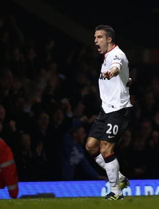Robin van Persie of Manchester United celebrates scoring an equal goal in the second half during the Barclays Premier League match between West Ham United and Manchester United at Upton Park in London, Britain, on April 17, 2013. The match ended with a 2-2 draw. (Xinhua Wang Lili) BRITAIN-LONDON-SOCCER-PREMIER LEAGUE-WEST HAM VS MAN UTD ManU