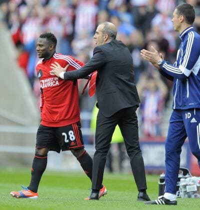 Sunderland manager Paolo Di Canio celebrates at the final whistle with goal scorer Stephane Sessegnon - Barclays Premier League - Sunderland vs Everton - Stadium of Light - Sunderland - 20 04 13 - Picture Richard Lee Sportimage EDITORIAL USE ONLY. No use with unauthorised audio, video, data, fixture lists, club league logos or live services. Online in-match use limited to 120 images, no video emulation. No use in betting, games or single club league player publications.