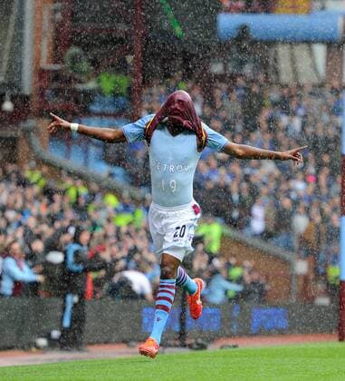 Christian Benteke of Aston Villa celebrates scoring the first goal by unveiling a t-shirt in support of Stiliyan Petrov of Aston Villa who is fighting Leukemia - Barclays Premier League - Aston Villa vs Chelsea - Villa Park Stadium - Birmingham - England - 11 05 13 - Picture Simon Bellis Sportimage EDITORIAL USE ONLY. No use with unauthorised audio, video, data, fixture lists, club league logos or live services. Online in-match use limited to 120 images, no video emulation. No use in betting, games or single club league player publications.