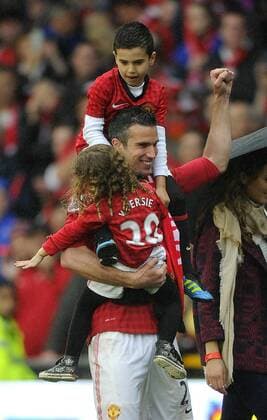 Robin van Persie of Manchester United celebrates with his children - Barclays Premier League - Manchester United ManU - Old Trafford Stadium - Manchester - England - 12 05 13 - Picture Simon Bellis Sportimage EDITORIAL USE ONLY. No use with unauthorised audio, video, data, fixture lists, club league logos or live services. Online in-match use limited to 120 images, no video emulation. No use in betting, games or single club league player publications.