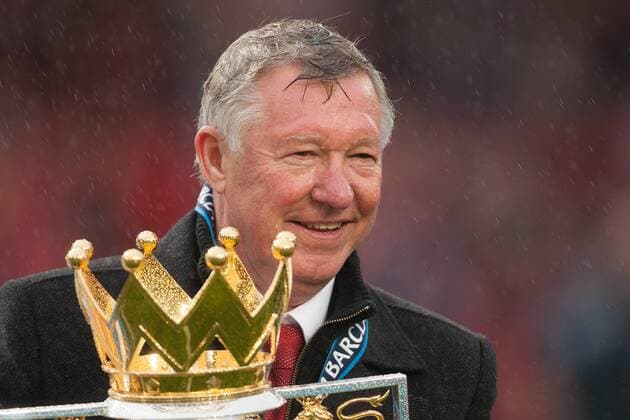 Football - Premier League 2012 2013 - Manchester United - Alex Ferguson, manager of Manchester United celebrates with the trophy at Old Trafford