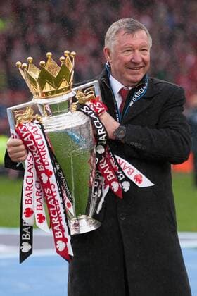Football - Premier League 2012 2013 - Manchester United - Alex Ferguson, manager of Manchester United celebrates with the trophy at Old Trafford