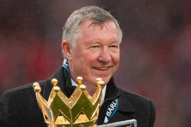Football - Premier League 2012 2013 - Manchester United ae Alex Ferguson, manager of Manchester United celebrates with the trophy at Old Trafford