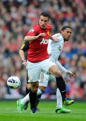 Robin van Persie of Manchester United tussles with Jonathan de Guzman of Swansea City - Barclays Premier League - Manchester United (ManU) - Old Trafford Stadium - Manchester - England - 12 05 13 - EDITORIAL USE ONLY. No use with unauthorised audio, video, data, fixture lists, club league logos or live services. Online in-match use limited to 120 images, no video emulation. No use in betting, games or single club league player publications.