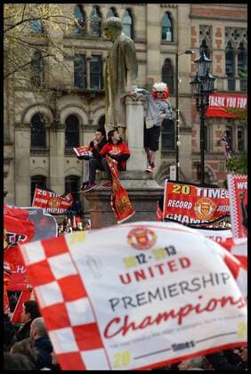 Manchester United Fans wait for Manchester United players to turn up in Albert Square, Manchester, Manchester United celebrate winning their 20th league title winning the Premier League, Monday May 13, 2013. AndrewxParsonsx xi-Images AJP