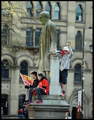 Manchester United Fans wait for Manchester United players to turn up in Albert Square, Manchester, Manchester United celebrate winning their 20th league title winning the Premier League, Monday May 13, 2013. AndrewxParsonsx xi-Images AJP