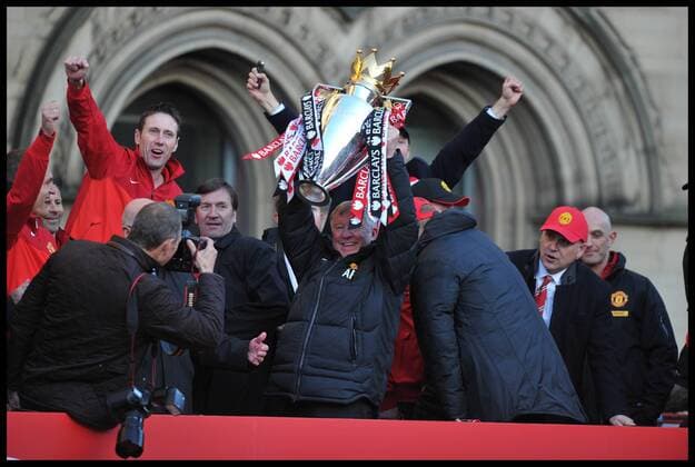 Sir Alex Ferguson lifts the Trophy as he addresses fans in Albert Square, Manchester, As Manchester United celebrate winning their 20th league title winning the Premier League, Monday May 13, 2013. AndrewxParsonsx xi-Images AJP