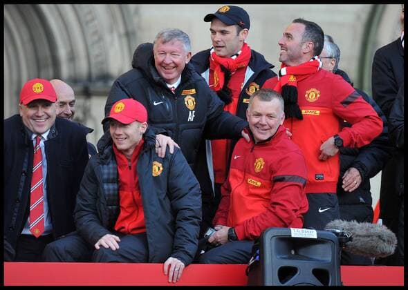 Sir Alex Ferguson takes a picture on his Mobile phone of the fans in Albert Square, Manchester, As Manchester United celebrate winning their 20th league title winning the Premier League, Monday May 13, 2013. AndrewxParsonsx xi-Images AJP