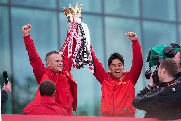 Tom Cleverley and Shinji Kagawa of Manchester United - Manchester United - Premier League Trophy Parade - Manchester - England -13 05 2013 - EDITORIAL USE ONLY. No use with unauthorised audio, video, data, fixture lists, club league logos or live services. Online in-match use limited to 120 images, no video emulation. No use in betting, games or single club league player publications.