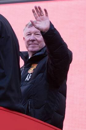 Alex Ferguson, manager of Manchester United waves from the back of the bus - Manchester United - Premier League Trophy Parade - Manchester - England -13 05 2013 - EDITORIAL USE ONLY. No use with unauthorised audio, video, data, fixture lists, club league logos or live services. Online in-match use limited to 120 images, no video emulation. No use in betting, games or single club league player publications.