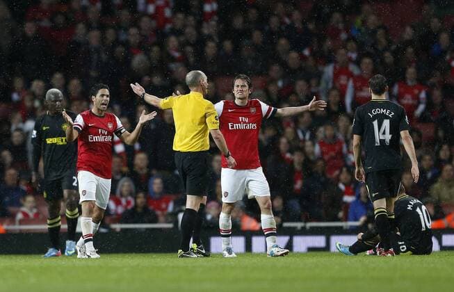 Arsenal s Mikel Arteta and Tomas Rosicky berate referee Mike Dean after his award of a freekick leading to Wigan s opening goal - Barclays Premier League - Arsenal vs Wigan - Emirates Stadium - London - 14 05 2013 - Pic David Klein Sportimage EDITORIAL USE ONLY. No use with unauthorised audio, video, data, fixture lists, club league logos or live services. Online in-match use limited to 120 images, no video emulation. No use in betting, games or single club league player publications.