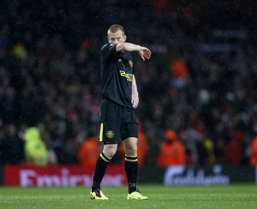 Wigan s Ben Watson looks on dejected at the final whistle - Barclays Premier League - Arsenal vs Wigan - Emirates Stadium - London - 14 05 2013 - Pic David Klein Sportimage EDITORIAL USE ONLY. No use with unauthorised audio, video, data, fixture lists, club league logos or live services. Online in-match use limited to 120 images, no video emulation. No use in betting, games or single club league player publications.