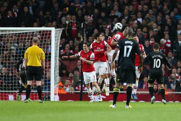 Football - 2012 2013 Premier League - Arsenal vs Wigan Wigan s Shaun Maloney scores a free kick at the Emirates Stadium, London