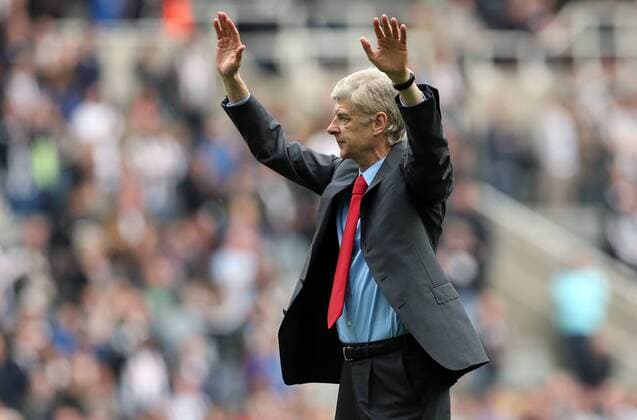 Football - English Premiership - Newcastle v Arsenal Arsesnal manager Arsene Wenger celebrates securing Champions League football during the Newcastle v Arsenal, Barclay s Premier League football match at St James Park, Newcastle. Colorsport 19th May 2013
