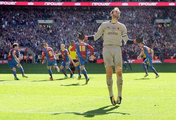Football : Championship play-off final Crystal Palace Wembley Manuel Almunia - Watford goalkeeper shows his anguish as the Palace players turn away to celebrate after Kevin Phillips scored his penalty kick