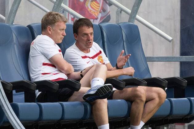 David Moyes, manager of Manchester United talks with Dr Steve McNally before kick off - AIK Stockholm vs. Manchester United - Friendly - Stockholm - Sweden - 06 08 2013 Pic Philip Oldham Sportimage EDITORIAL USE ONLY. No use with unauthorised audio, video, data, fixture lists, club league logos or live services. Online in-match use limited to 120 images, no video emulation. No use in betting, games or single club league player publications.