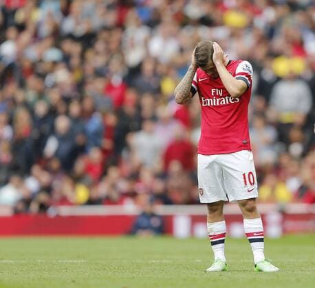 Arsenal s Jack Wilshere looks on dejected - FC Arsenal London vs Aston Villa FC - Barclays Premiership - Emirates Stadium - London - England -17 08 2013 - EDITORIAL USE ONLY. No use with unauthorised audio, video, data, fixture lists, club league logos or live services. Online in-match use limited to 120 images, no video emulation. No use in betting, games or single club league player publications.