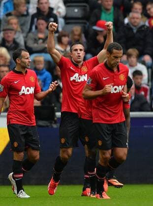Robin van Persie of Manchester United celebrates scoring the first goal - Barclays Premier League - Swansea City AFC vs Manchester United - Liberty Stadium - Swansea - Wales - 17 08 13 - EDITORIAL USE ONLY. No use with unauthorised audio, video, data, fixture lists, club league logos or live services. Online in-match use limited to 120 images, no video emulation. No use in betting, games or single club league player publications.