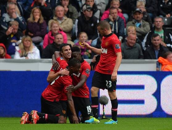 Robin van Persie of Manchester United celebrates scoring the first goal - Barclays Premier League - Swansea City AFC vs Manchester United - Liberty Stadium - Swansea - Wales - 17 08 13 - EDITORIAL USE ONLY. No use with unauthorised audio, video, data, fixture lists, club league logos or live services. Online in-match use limited to 120 images, no video emulation. No use in betting, games or single club league player publications.