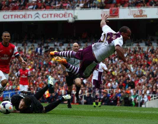 Arsenal FC London v Aston Villa . . London, UK . . 17.08.2013 Gabriel Agbonlahor (AV) is pulled down by Wojciech Szczesny(A) to give away a penalty.