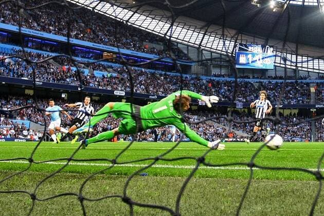 Sergio Aguero of Manchester City scores his sides second goal - Manchester City vs. Newcastle United - Premier League - Etihad Stadium - Manchester - 19 08 2013 Pic Philip Oldham Sportimage EDITORIAL USE ONLY. No use with unauthorised audio, video, data, fixture lists, club league logos or live services. Online in-match use limited to 120 images, no video emulation. No use in betting, games or single club league player publications.