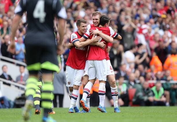 Arsenal s Per Mertesacker celebrates scoring his sides second goal Arsenal v Stoke - Barclays Premier League- Emirates Stadium - London - England -22 09 2013 - EDITORIAL USE ONLY. No use with unauthorised audio, video, data, fixture lists, club league logos or live services. Online in-match use limited to 120 images, no video emulation. No use in betting, games or single club league player publications.