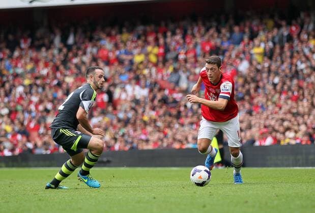 Arsenal s Mesut Ozil in action Arsenal v Stoke - Barclays Premier League- Emirates Stadium - London - England -22 09 2013 - EDITORIAL USE ONLY. No use with unauthorised audio, video, data, fixture lists, club league logos or live services. Online in-match use limited to 120 images, no video emulation. No use in betting, games or single club league player publications.