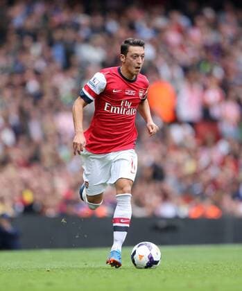 Arsenal s Mesut Ozil in action Arsenal v Stoke - Barclays Premier League- Emirates Stadium - London - England -22 09 2013 - EDITORIAL USE ONLY. No use with unauthorised audio, video, data, fixture lists, club league logos or live services. Online in-match use limited to 120 images, no video emulation. No use in betting, games or single club league player publications.