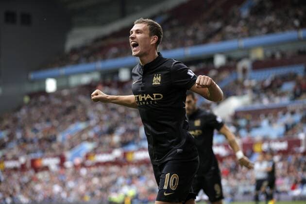 Edin Dzeko celebrates scoring to give Manchester City the lead at 2-1 - Football - Barclays Premier League - Aston Villa vs Manchester City - Villa Park Birmingham - Season 2013-2014 - September 28th 2013 - Photograph Malcolm Couzens Sportimage EDITORIAL USE ONLY. No use with unauthorised audio, video, data, fixture lists, club league logos or live services. Online in-match use limited to 120 images, no video emulation. No use in betting, games or single club league player publications.
