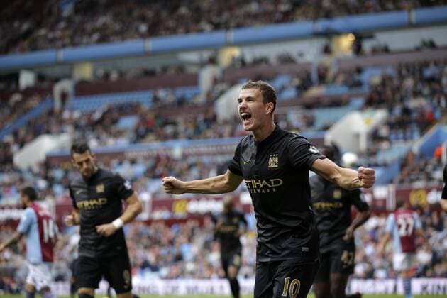 Edin Dzeko celebrates scoring to give Manchester City the lead at 2-1 - Football - Barclays Premier League - Aston Villa vs Manchester City - Villa Park Birmingham - Season 2013-2014 - September 28th 2013 - Photograph Malcolm Couzens Sportimage EDITORIAL USE ONLY. No use with unauthorised audio, video, data, fixture lists, club league logos or live services. Online in-match use limited to 120 images, no video emulation. No use in betting, games or single club league player publications.