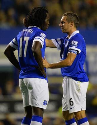 Phil Jagielka of Everton (R) talks to Romelu Lukaku of Everton on his debut - Barclays Premier League - Everton vs Newcastle Utd - Goodison Park Stadium - Liverpool - England - 30 09 13 - Picture Simon Bellis Sportimage EDITORIAL USE ONLY. No use with unauthorised audio, video, data, fixture lists, club league logos or live services. Online in-match use limited to 120 images, no video emulation. No use in betting, games or single club league player publications.