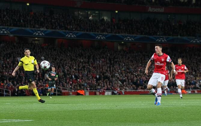 Arsenal s Mesut Ozil scoring his sides opening goal Arsenal FC Lodnon v SSC Napoli - Champions League - Emirates Stadium - London - England -01 10 2013 - EDITORIAL USE ONLY. No use with unauthorised audio, video, data, fixture lists, club league logos or live services. Online in-match use limited to 120 images, no video emulation. No use in betting, games or single club league player publications.