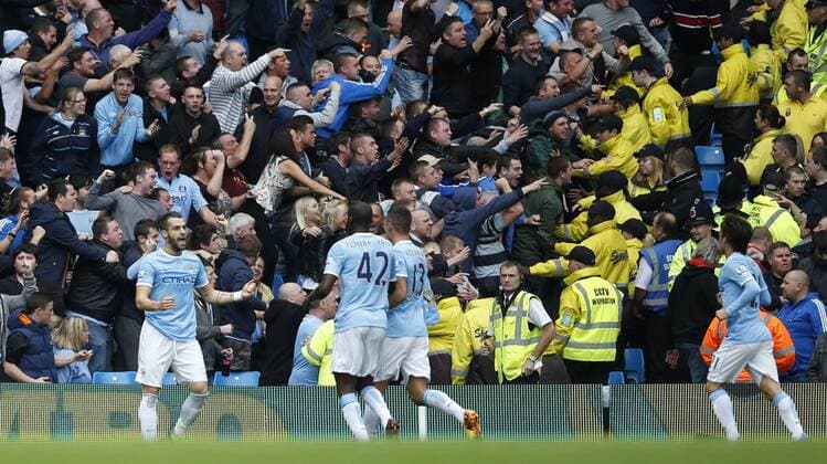 MANCHESTER, Alvaro Negredo (1st, L) of Manchester City celebrates scoring with teammates during the Barclays Premier League match between Manchester City and Everton at Etihad Stadium in Manchester, Britain on Oct. 5, 2013.(Xinhua Wang Lili) FOR EDITORIAL USE ONLY. NOT FOR SALE FOR MARKETING OR ADVERTISING CAMPAIGNS. NO USE WITH UNAUTHORIZED AUDIO, VIDEO, DATA, FIXTURE LISTS, CLUB LEAGUE LOGOS OR LIVE SERVICES. ONLINE IN-MATCH USE LIMITED TO 45 IMAGES, NO VIDEO EMULATION. NO USE IN BETTING, GAMES OR SINGLE CLUB LEAGUE PLAYER PUBLICATIONS. (SP)BRITAIN-MANCHESTER-SOCCER-PREMIER LEAGUE-MAN CITY VS EVERTON